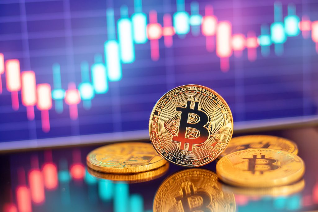 Gold Bitcoin Crypto Currency On Background Of Chart Diagram